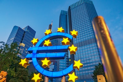 European Union blue flag with golden stars representing the euro stablecoin push by 12 European banks