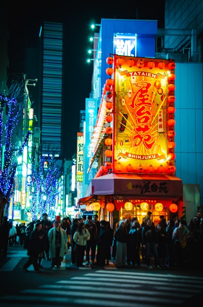 Asian stock market trading floor with neon signage representing the Nikkei and Kospi rally on oil price drop