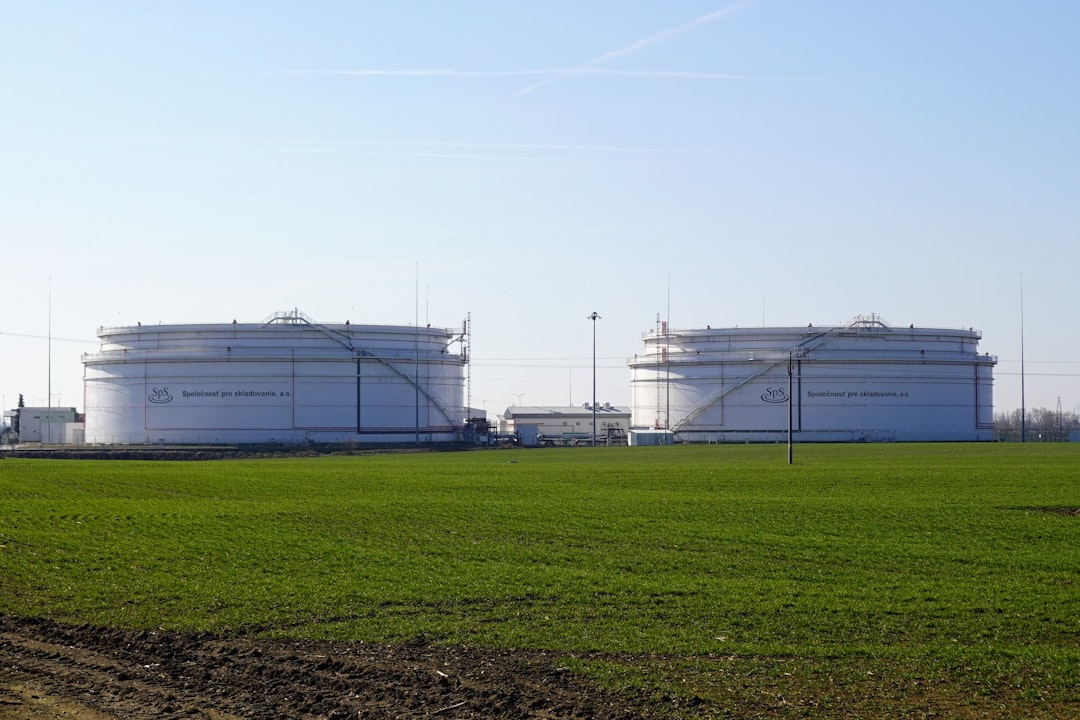 Oil storage tanks in industrial field representing energy infrastructure