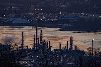 Oil refinery operations at dusk showing energy infrastructure and industrial complex