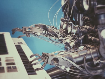 Robot playing piano symbolizing AI replacing human workers at Oracle