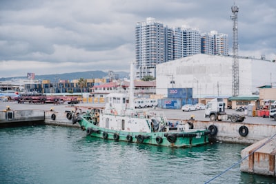 Tugboat in busy harbor symbolizing shifting global supply chain dynamics